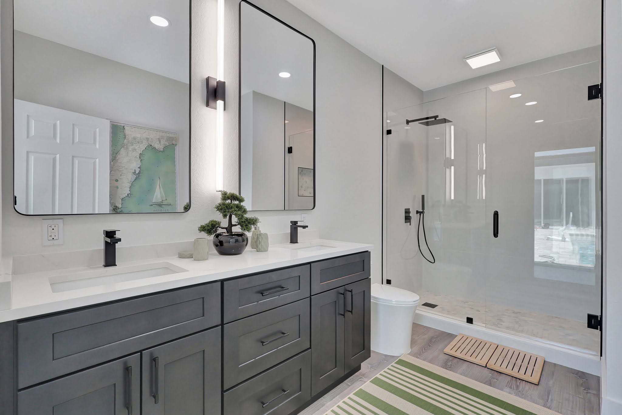 Modern Villa Verano estate bathroom with a double vanity and glass shower